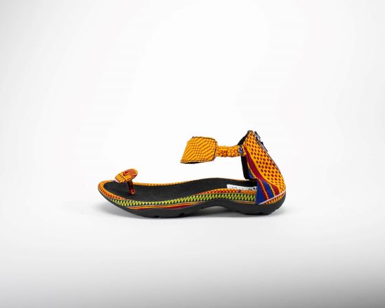 yellow green kente print toa button sandal. side view