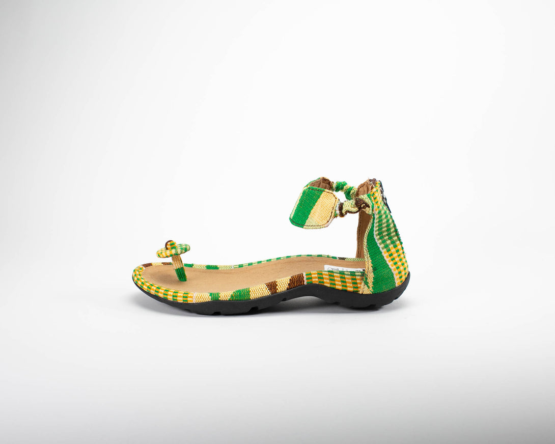 Green Kente woven sandal with toe side view.  For women