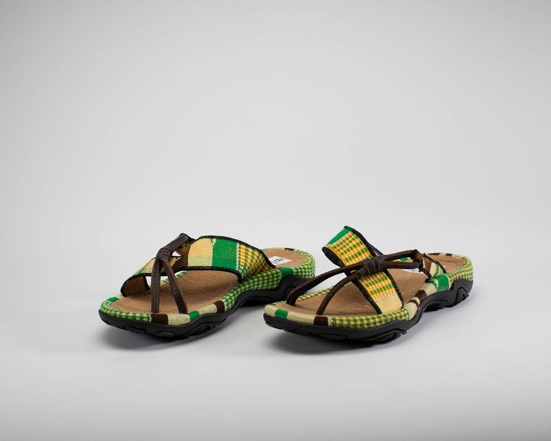 Men green kente woven sandal with leather. Side view.