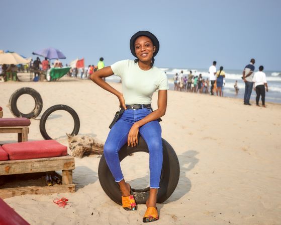 Woman life style image on a beach with pink slid 