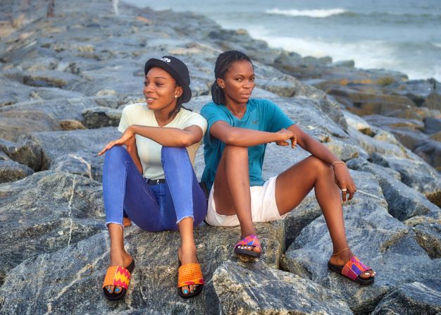 Woman life style image on a beach with pink and purple slid 