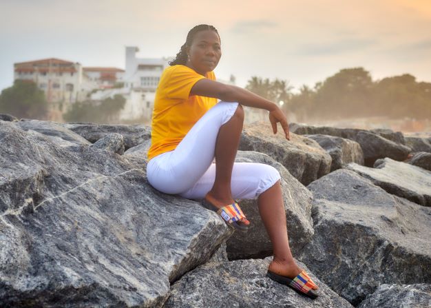 Woman life style image on a beach with orange slid 