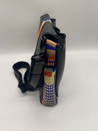 orange kente woven and black leather comb bag side view