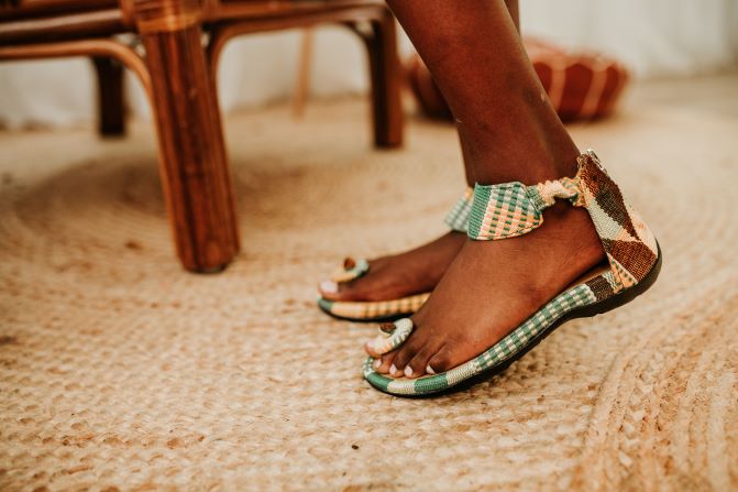 Green kente hand woven sandal with toa front view. For women