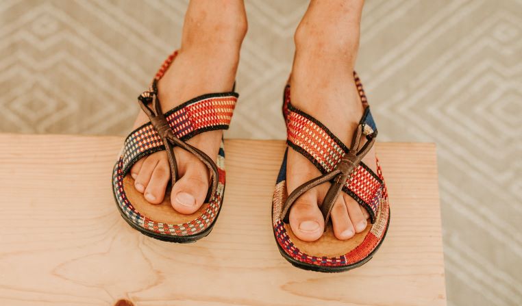 Men orange kente woven sandal with leather. Top view.