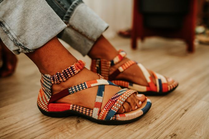 Women orange kente woven sandal with zipper on the side. Front  view