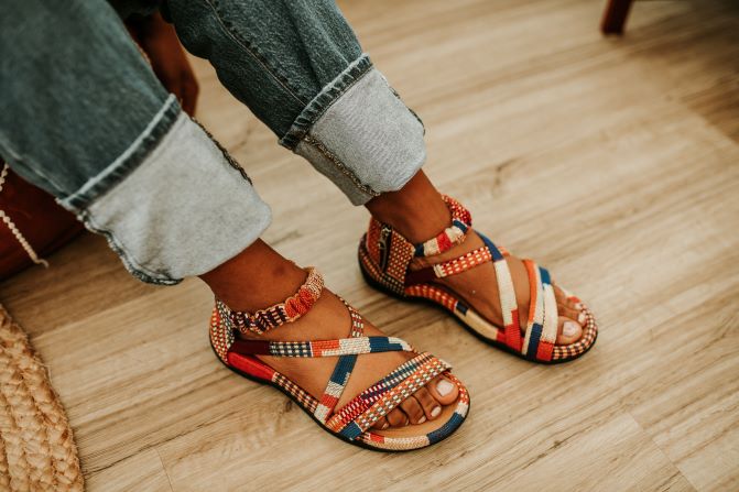 Women orange kente woven sandal with zipper on the side. Side view