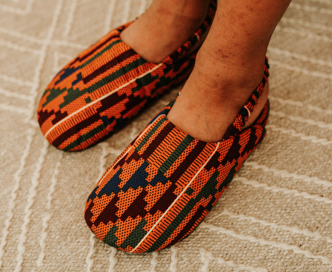 Men kente print mule top view.