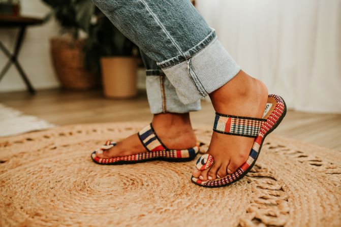 Orange kente woven sandal with toa for women. Top view