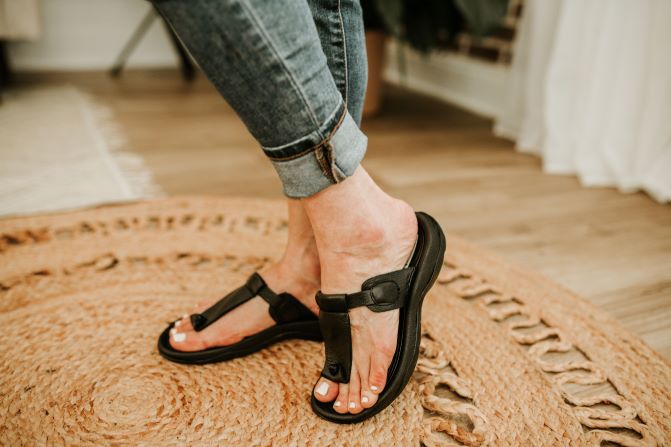 T-strap black leather sandals for women. Side view